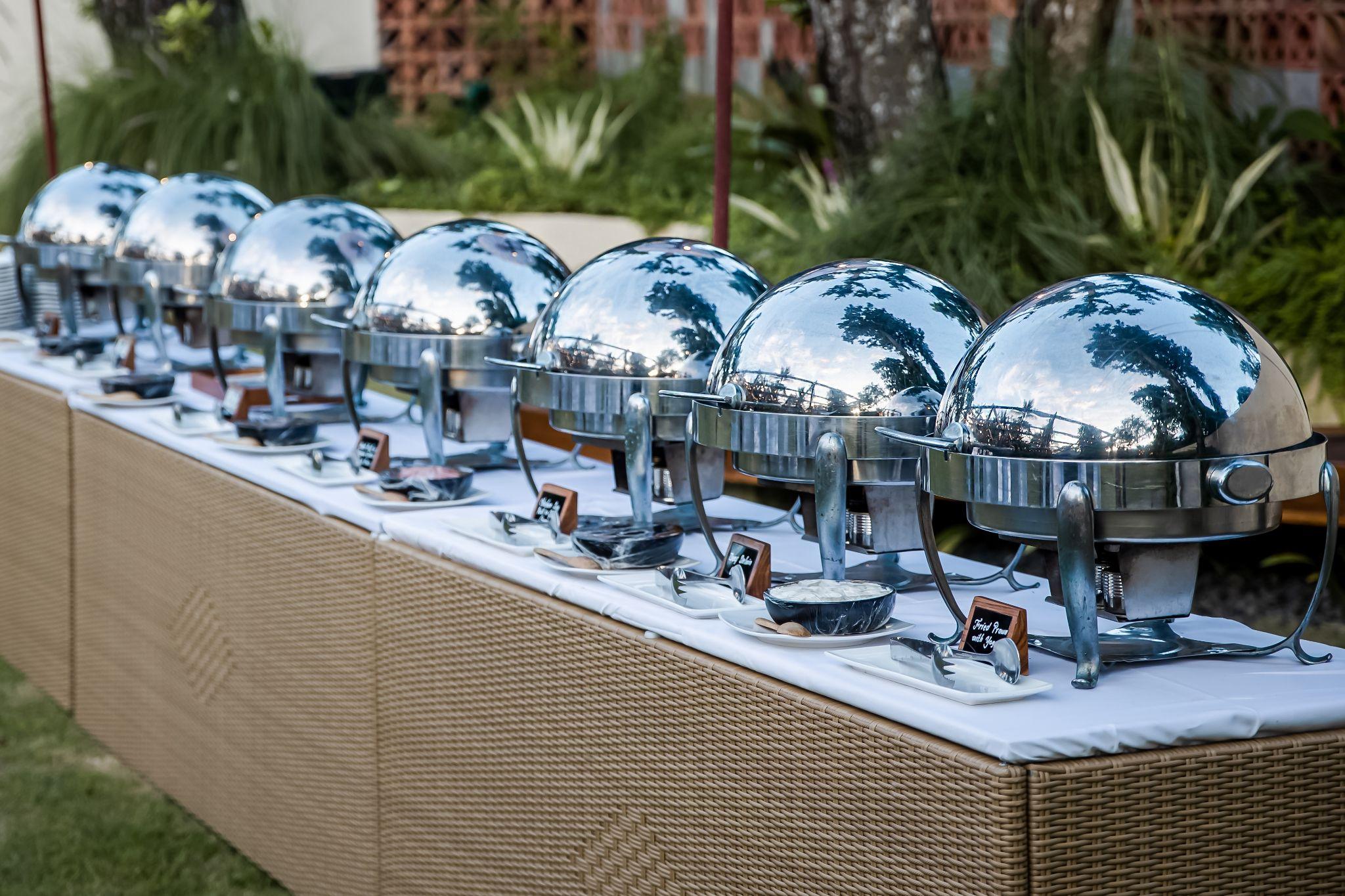 Buffet setup at a Seattle corporate event with fresh entrées and sides, illustrating seamless catering coordination in meeting spaces with a view